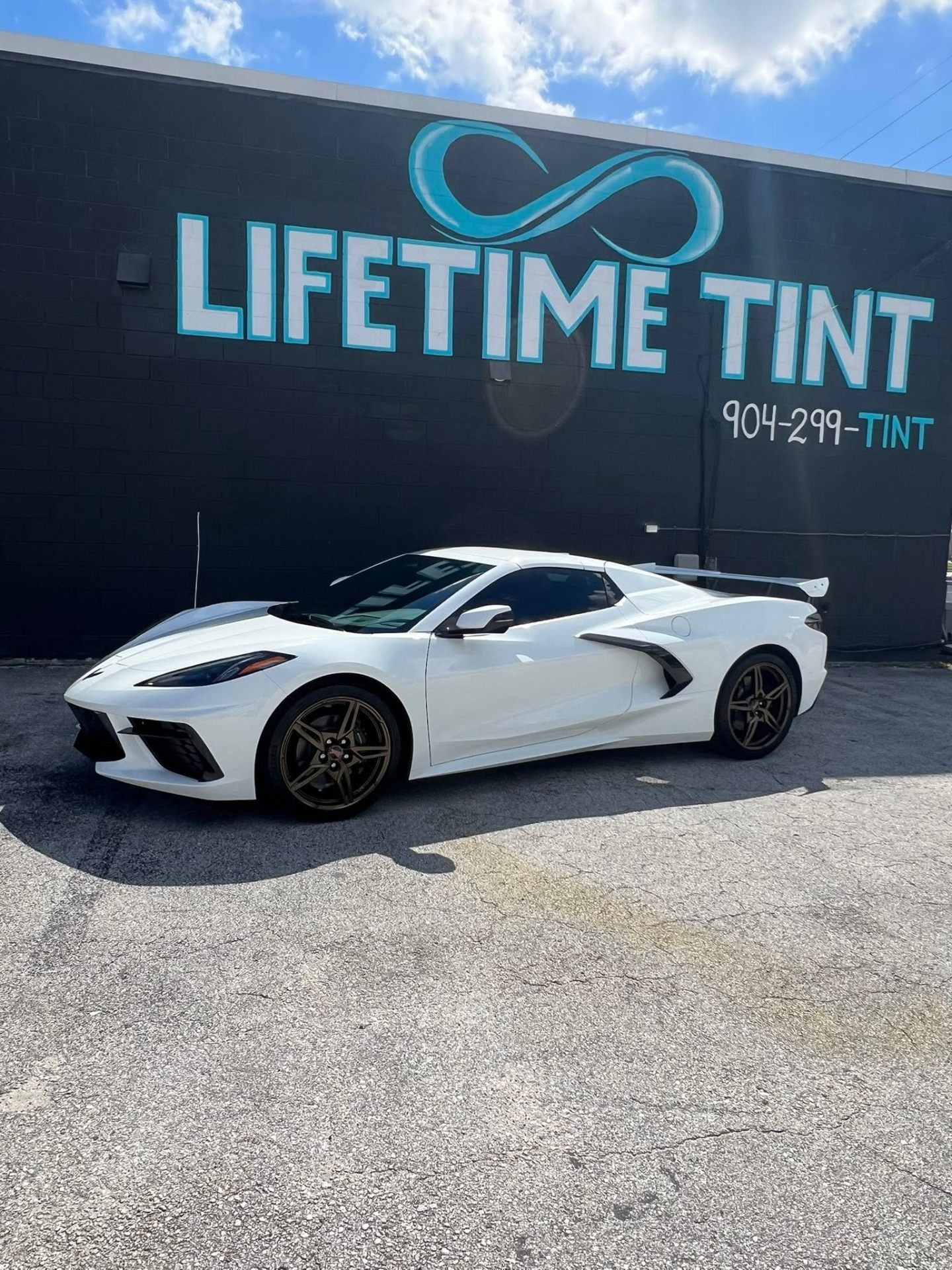 Corvette parked outside Lifetime Tint's Atlantic Blvd shop