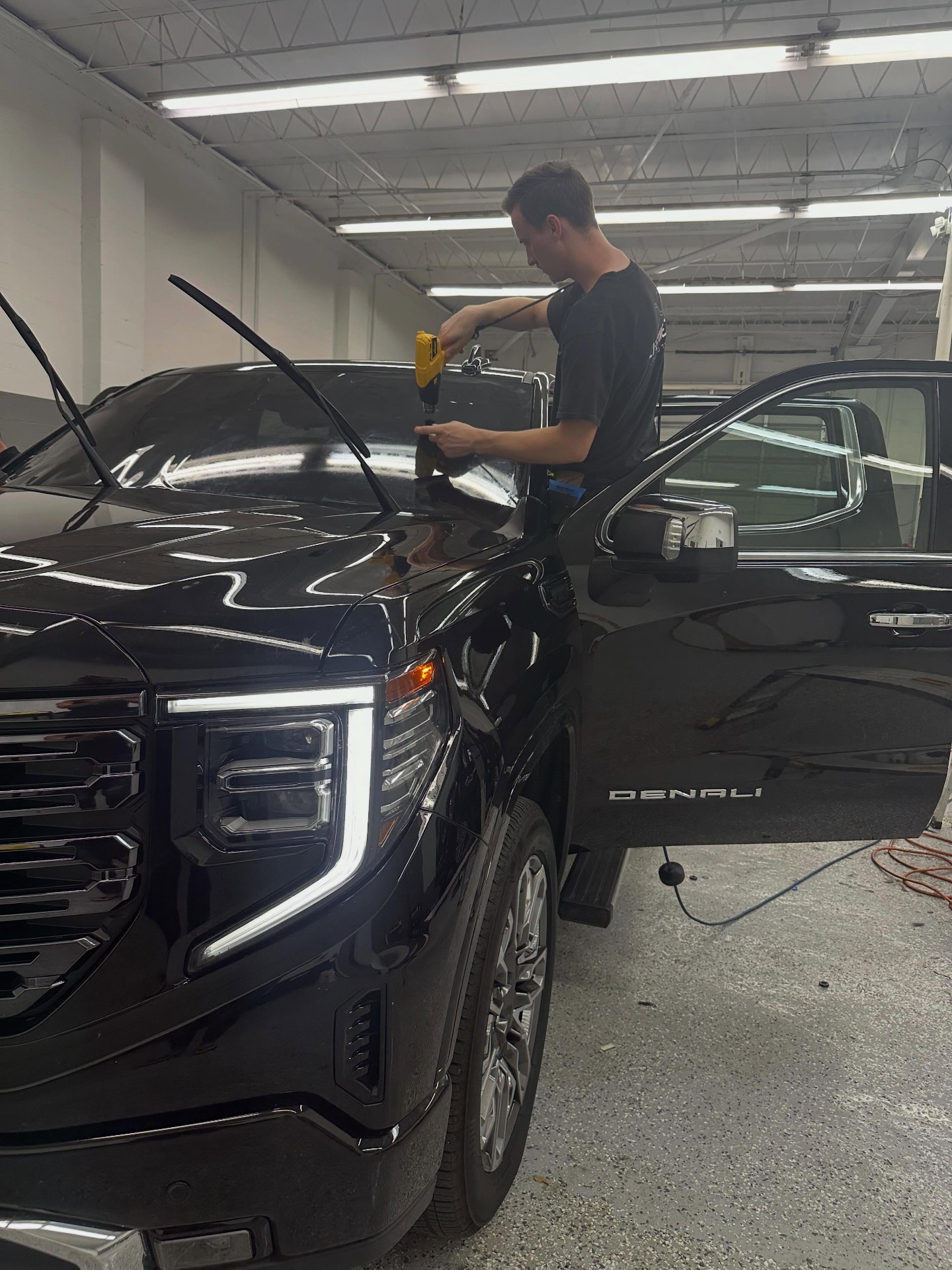 GMC Denali during a professional window tint install in Jacksonville